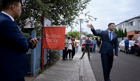 Nelson Alexander auctioneer James Pilliner calls for bids during the auction.