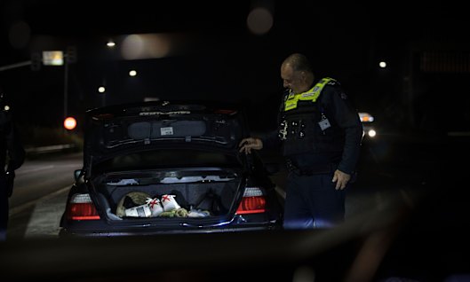 Acting Superintendent Andy McKee pulls over a motorist in the early hours of August 6 as part of Victoria Police’s Operation Trinity, targeting aggravated burglaries and associated car thefts.