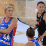 Swift Helen Housby looks to dish off a pass against the Magpies at Ken Rosewall Arena in Sydney.
