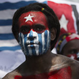 A Papuan student protests in Medan on August 31 with his face painted in the colours of the banned separatist 'Morning Star' flag.