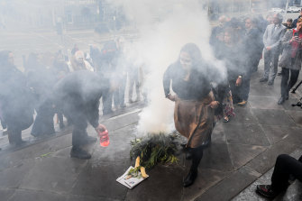 The smoking ceremony on the steps of parliament on Wednesday morning.