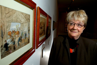 Author and lecturer on convict history Babette Smith poses for a photo in front of an artwork by ST Gill at the Gallery of Ballarat, 2016. 