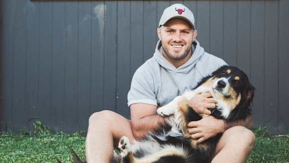 Lachlan McCaffrey with dog Koda, who he bought when he returned to Australia last year.