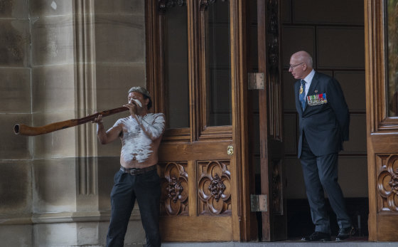 A didgeridoo player helps farewell Governor David Hurley at Government House.