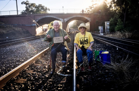 Bill Ryan and Susie Gold locked to Carrington Railway in Newcastle, an action he took at the age of 96.