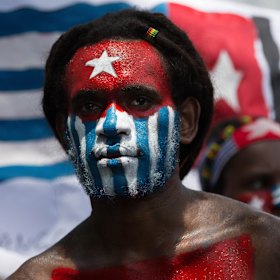 A Papuan student protests in Medan on August 31 with his face painted in the colours of the banned separatist 'Morning Star' flag.