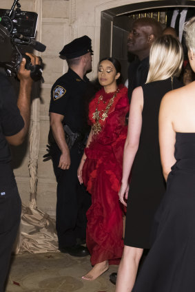 Cardi B, with a swollen bump on her forehead and barefoot, leaves after an altercation at the 'Harper's Bazaar' Icons party in New York.
