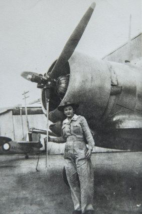 Sheila pictured with an Australian Wirraway aircraft on which she worked during the war.