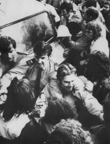 “Police struggle with the crowd who demonstrated outside Auckland Magistrate’s Court yesterday.”