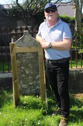Steve Foley at the grave of his great-great-grandmother, Janet Pole Williamson, in the Knab Road Cemetery, Lerwick, Shetland.