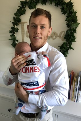 Higher duties: Cameron McInnes with new baby Talanoa.