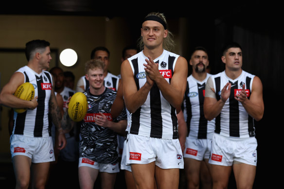 Darcy Moore leads Collingwood out.
