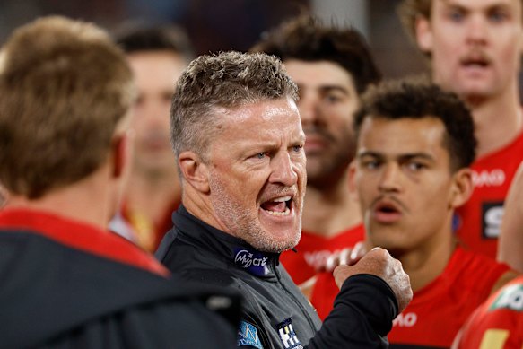 Suns coach Damien Hardwick talks to his players.