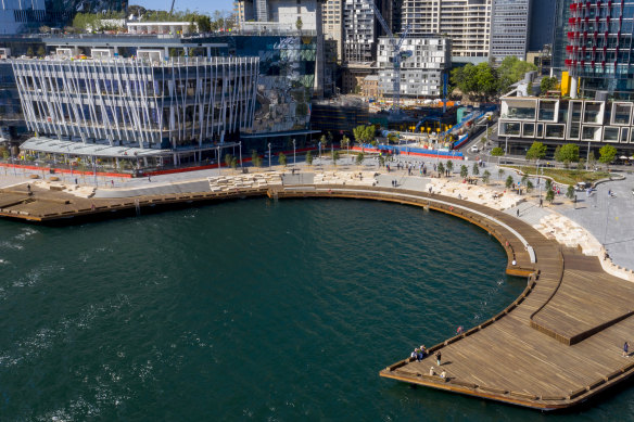 The precinct includes a pier and boardwalk that curves around a new cove in front of Crown's VIP casino tower. 