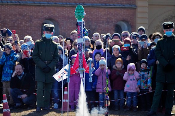 A model rocket shaped as a grenade is launched during a celebration of the 60th anniversary of Russia’s Yuri Gagarin’s first manned flight into space, in St Petersburg, Russia, on Sunday, April 11.