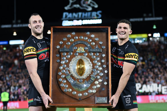 Penrith’s Isaah Yeo and Nathan Cleary with the NRL’s JJ Giltinan Shield last September.