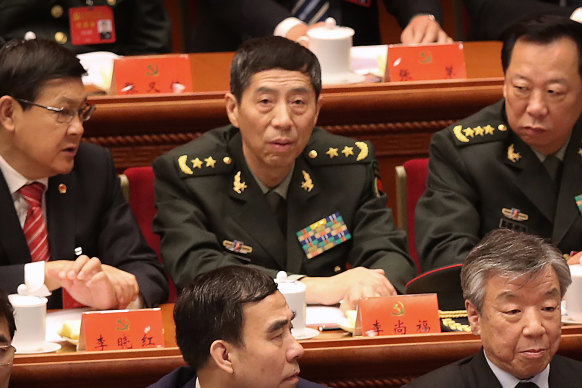 Li Shangfu, centre, the director of the Equipment Development Department of China’s Central Military Commission, attends the opening ceremony of China’s 19th Party Congress at the Great Hall of the People in Beijing.