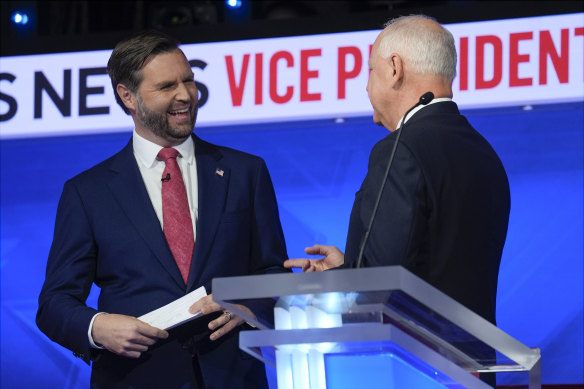 J.D. Vance and Tim Walz speak at the end of the debate.
