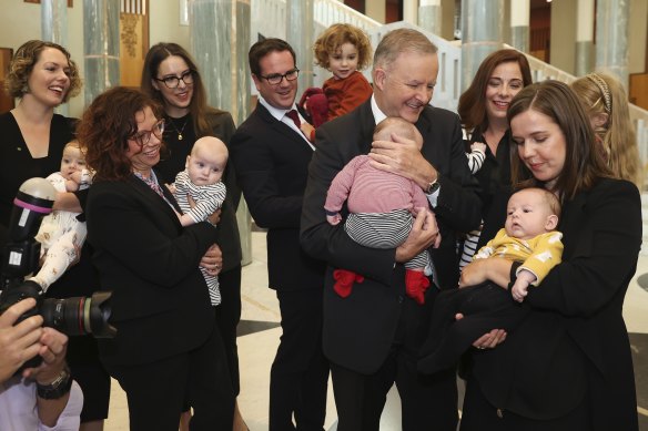 Labor leader Anthony Albanese with MPs Alicia Payne, Amanda Rishworth, Matt Keogh, Anika Wells and Kate Thwaites as he greets their new babies last year. 