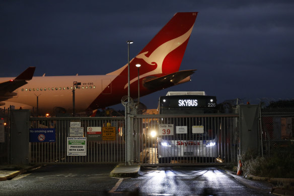 Returning travelers are taken straight from the plane to quarantine after the first repatriation flight to Melbourne from India landed on Thursday. 