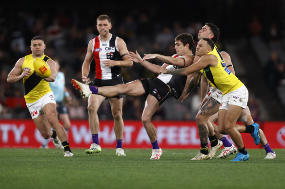 Jack Steele gets a kick away for St Kilda.