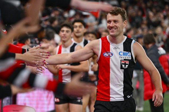 Jack Macrae of the Saints high-fives fans earlier this season.