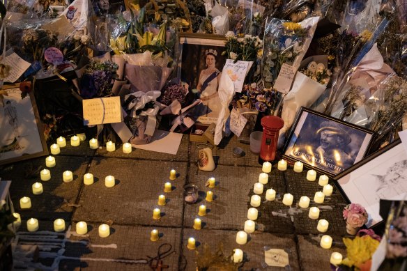 Flowers and messages are placed for Queen Elizabeth II outside the British Consulate in Hong Kong.