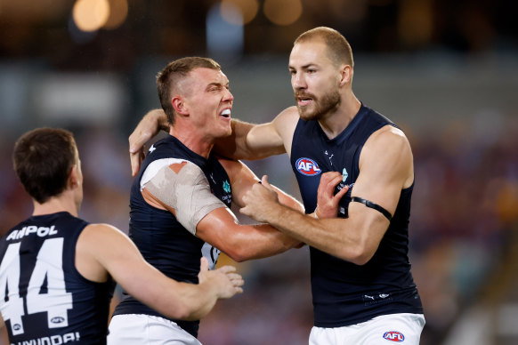 Harry McKay and Patrick Cripps (left) celebrate a goal.