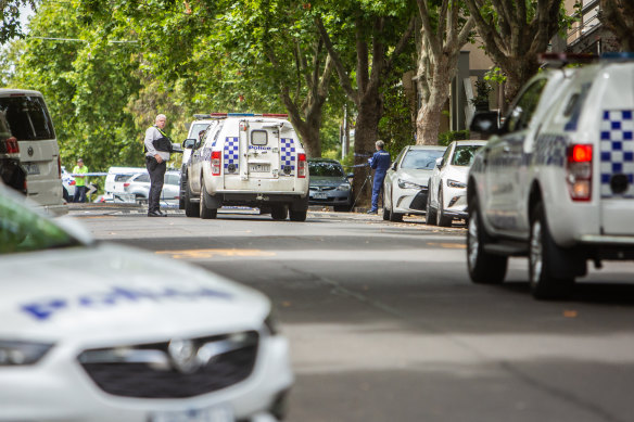 Police in Acland Street after a body was found in a laneway in 2023.