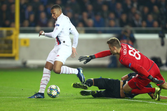 Kylian Mbappe scores Paris Saint-Germain's fourth goal against Club Brugge.