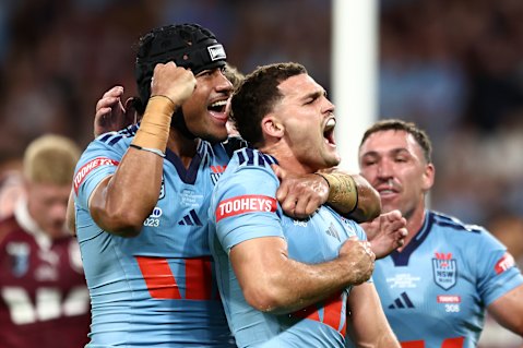 Nathan Cleary celebrates the first of his two tries in a dominating performance for NSW.
