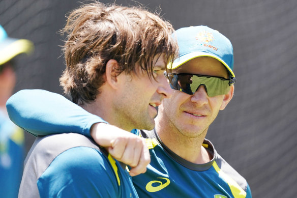 Tim Paine (right) with Joe Burns during a training session on Christmas Eve.