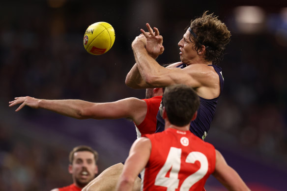 Nat Fyfe flies for a mark.