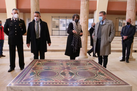Authorities stand around a 1.5 square metre mosaic dating back to 40 AD,  belonging to Caligula’s lavish ceremonial ships.