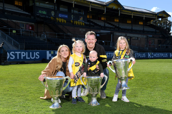Jack Riewoldt, pictured with his wife Carly and children Hazel, Tommy and Poppy, after announcing his retirement.