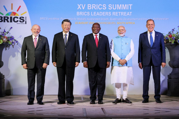 Brazil’s President Luiz Inacio Lula da Silva, China’s President Xi Jinping, South Africa’s President Cyril Ramaphosa, India’s Prime Minister Narendra Modi and Russia’s Foreign Minister Sergei Lavrov pose during BRICS summit in Johannesburg, on August 22.