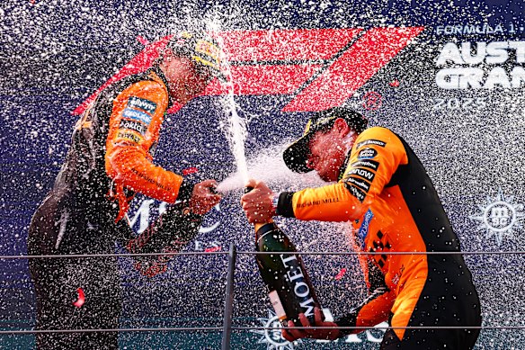 McLaren teammates Oscar Piastri and Lando Norris celebrate on the podium.