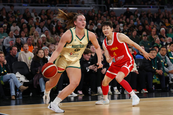 Isobel Borlase of the Opals drives to the basket against China.