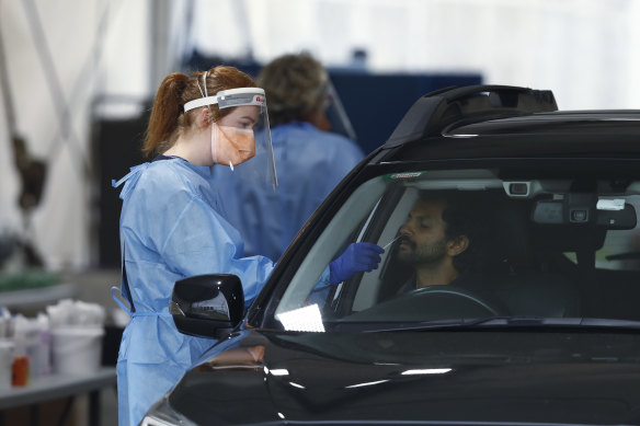 Medical staff administering COVID-19 tests in Melbourne.