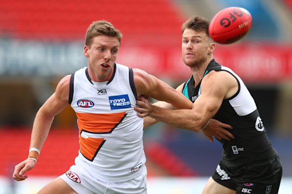 Aidan Corr and Robbie Gray compete for the ball on Sunday.