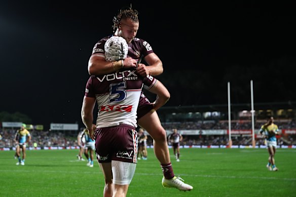 Blake Wilson celebrates the opening try for Manly on Saturday night.