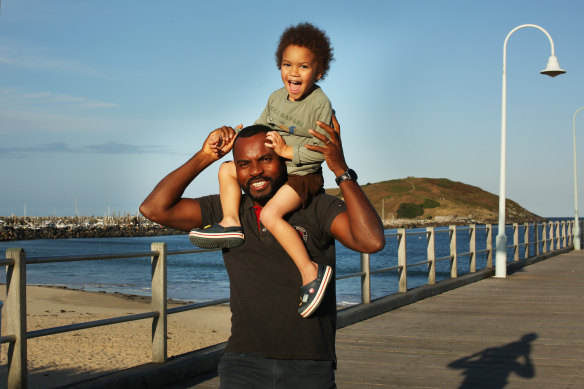 Refugee case worker Dodzi Kpodo, with his three-year-old son Louis, is the Australian Fathering Awards’ Community Father of the Year.