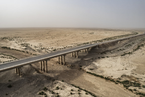The bridge that used to run over the waters of the large man-made Lake Hamrin, north-east of Baqubah, Iraq oin June. The impact of dams, power stations, and irrigation projects in Turkey and Iran has been drastic.