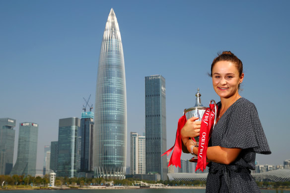 Ashleigh Barty with the trophy after her victory in the WTA Finals in Shenzhen last year. This year's tournament has been cancelled.