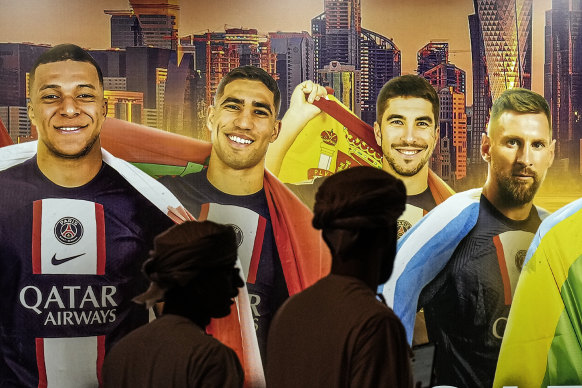 A painting of Mbappe and Hakimi (left and second left) with teammates at the Qatari-owned PSG, Carlos Soler and Lionel Messi, on a wall in Doha.