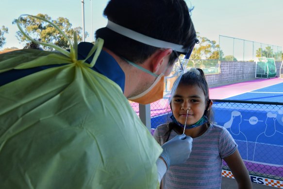Nine-year-old Tashayla Eulo receives a COVID-19 test at the Dubbo West walk-in clinic.