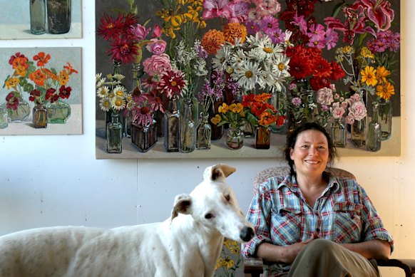 Lucy Culliton with greyhound Earl in her studio on her property at Bibbenluke Lodge.