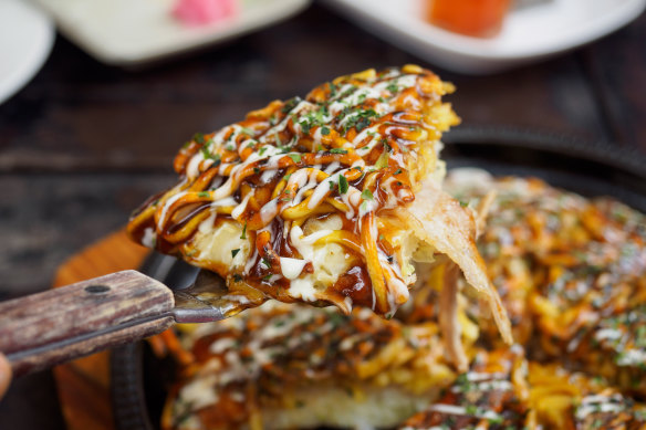 Greasy and satisfying: don’t leave without trying the Osaka-style okonomiyaki pancake.