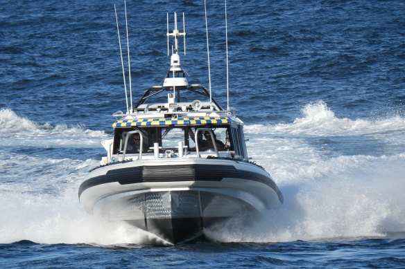 Volunteers on board Marine Rescue vessel Botany Port Hacking 30 searching for a missing rock fisherman.