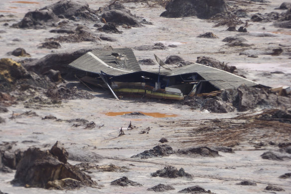 A structure is buried in mud after BHP-Vale’s Samarco dam failure in 2015.